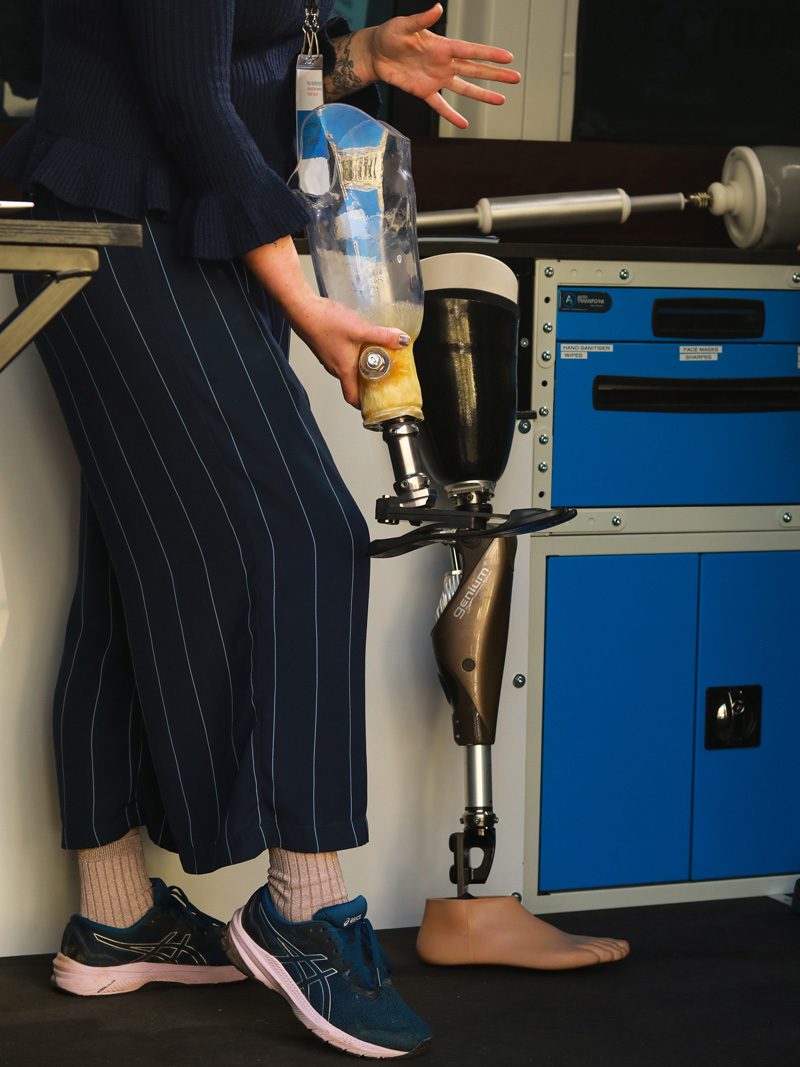 Technician, Summer O’Dwyer demonstrating different types of prosthetic limbs.