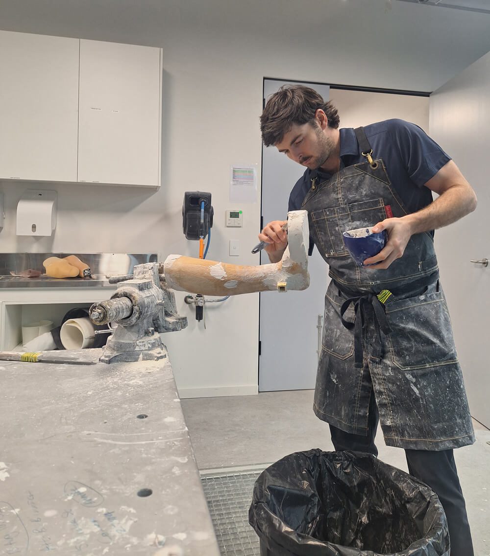 Daniel working on an AFO cast while on placement in Australia.